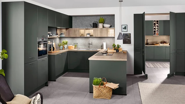Modern U-shaped soft green kitchen design by 21 Kitchens Ayrshire