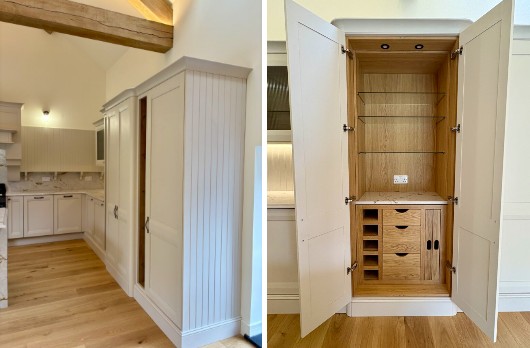 Bespoke kitchen pantry storage with cream cabinetry, oak interior shelving, glass shelves and integrated drawers by 21 Kitchens in Ayrshire.