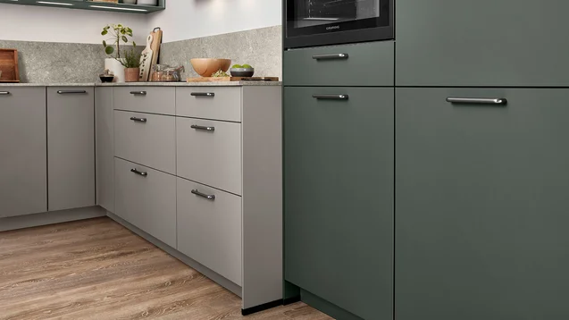 Close-up of mineral green and taupe grey kitchen cabinetry by 21 Kitchens Ayrshire