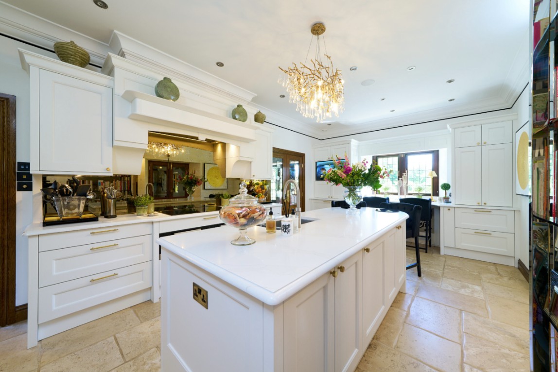 Luxury white shaker kitchen with large quartz island designed by 21 Kitchens in Stewarton, Ayrshire.